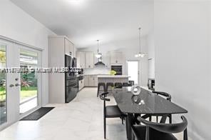 dining room featuring lofted ceiling