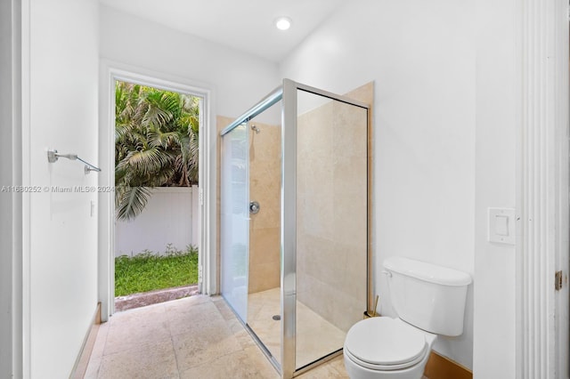 bathroom with toilet and walk in shower