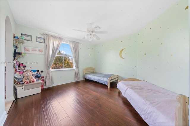 bedroom featuring ceiling fan and dark hardwood / wood-style flooring