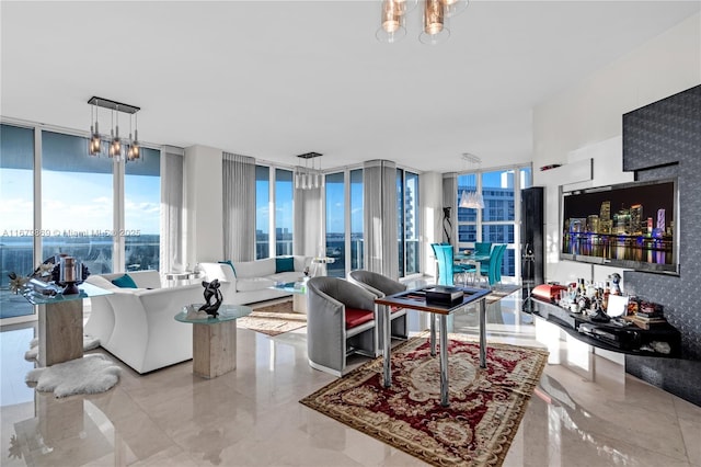 living room featuring expansive windows and a chandelier