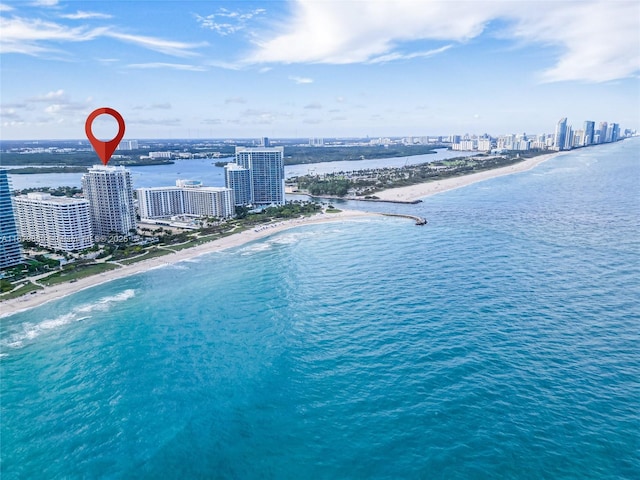 aerial view with a beach view and a water view