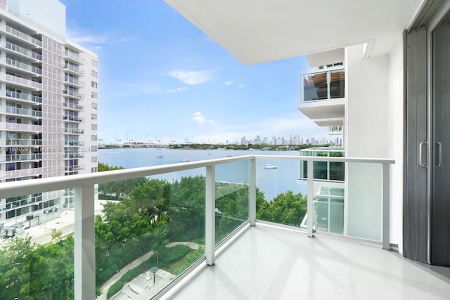 balcony featuring a water view