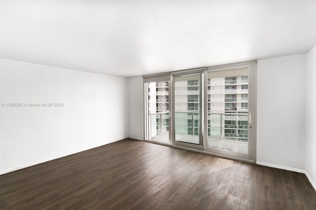 unfurnished room featuring dark hardwood / wood-style floors