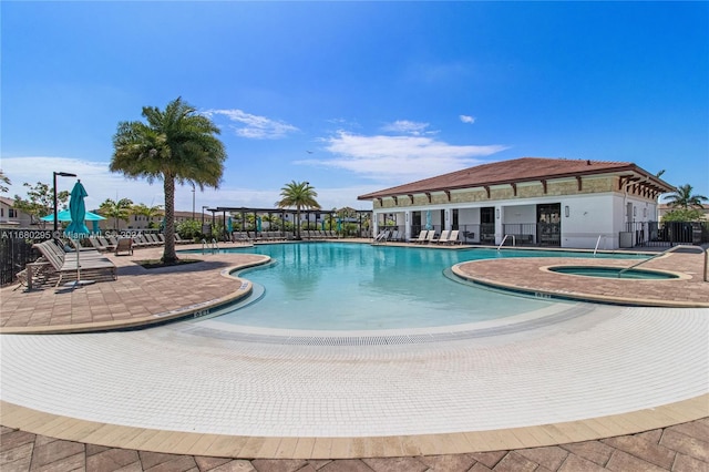 view of pool featuring a patio area and a community hot tub