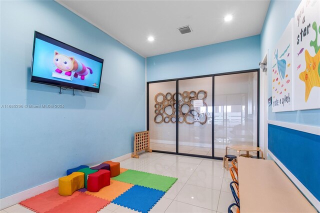 game room featuring light tile patterned flooring