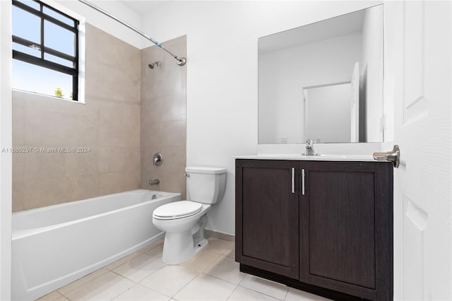 full bathroom featuring vanity, toilet, tile patterned floors, and tiled shower / bath