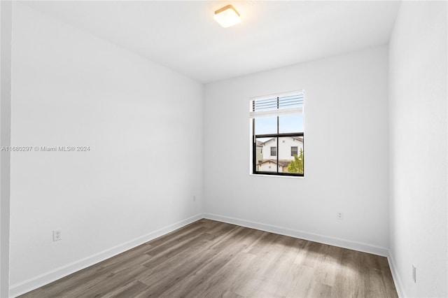 empty room featuring wood-type flooring