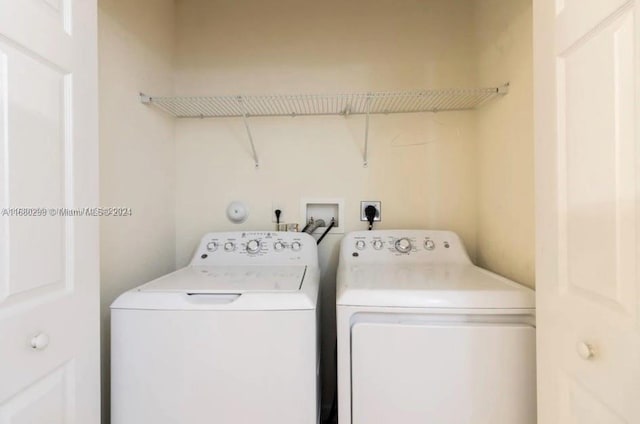 laundry area with washing machine and clothes dryer