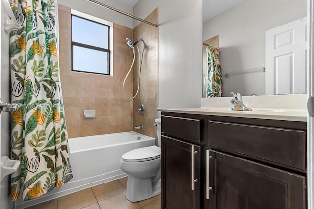 full bathroom featuring shower / bath combo with shower curtain, toilet, vanity, and tile patterned flooring