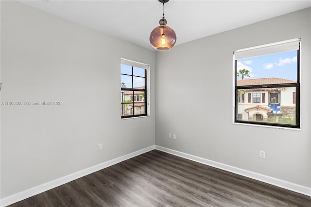 spare room with dark hardwood / wood-style floors