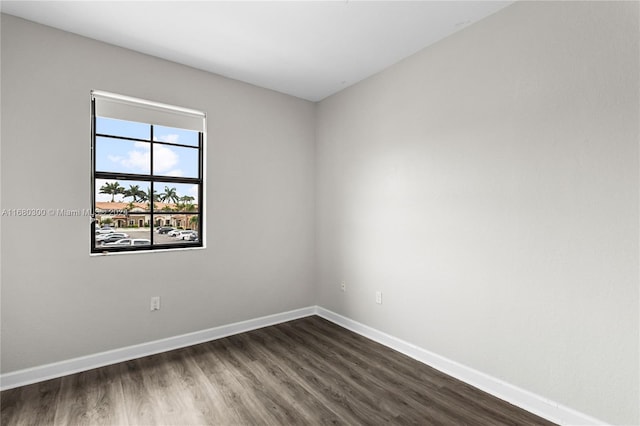 unfurnished room with dark hardwood / wood-style floors