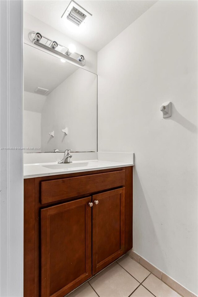 bathroom with vanity and tile patterned floors