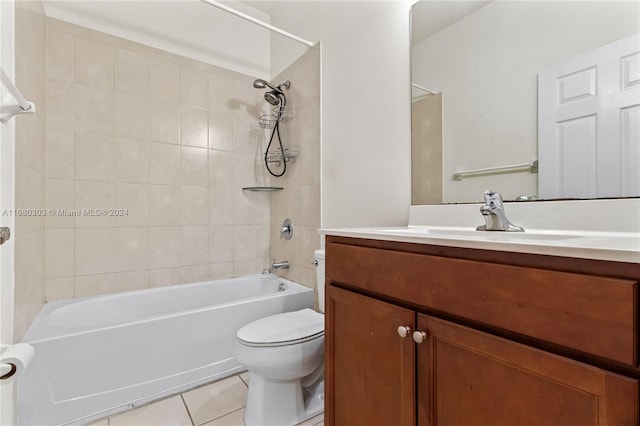 full bathroom with vanity, tiled shower / bath combo, toilet, and tile patterned flooring