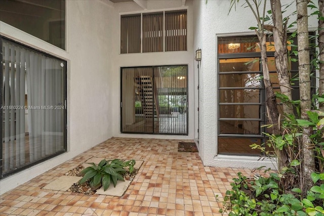 doorway to property with a patio area