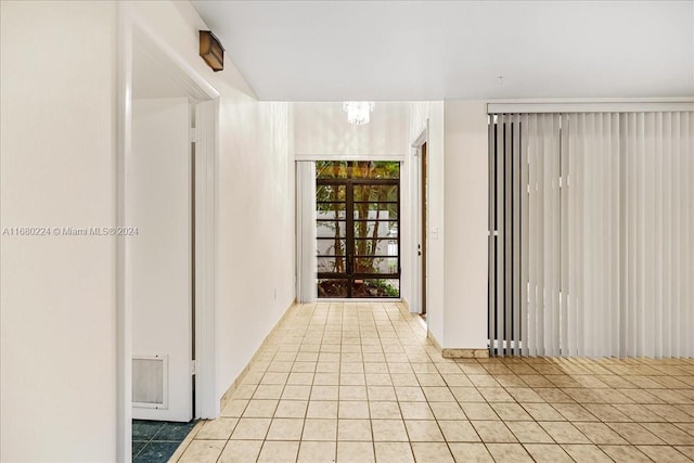 hallway featuring light tile patterned floors