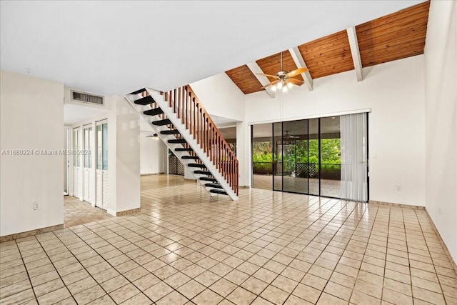 tiled spare room featuring vaulted ceiling with beams, ceiling fan, and wooden ceiling