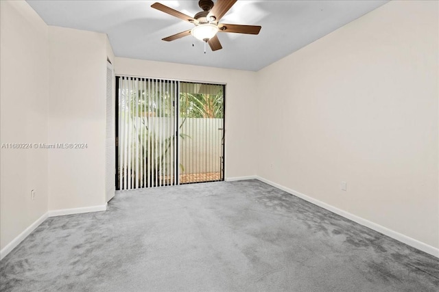 unfurnished room featuring ceiling fan and carpet floors