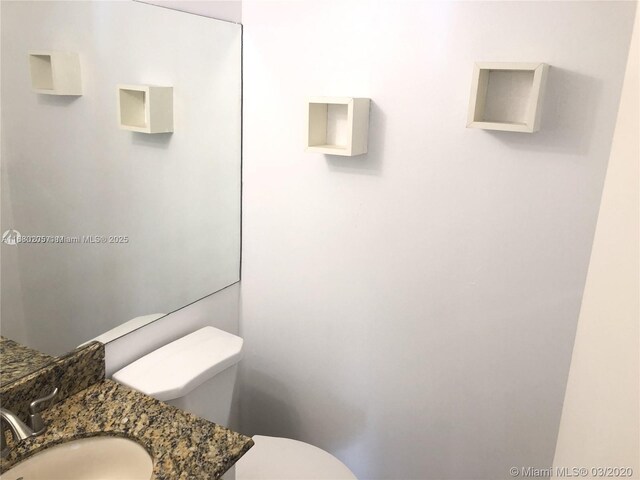 bathroom featuring sink and toilet