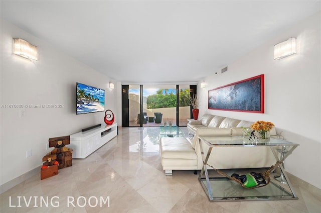 living room with floor to ceiling windows