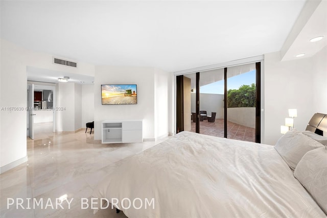 bedroom with access to outside and a wall of windows