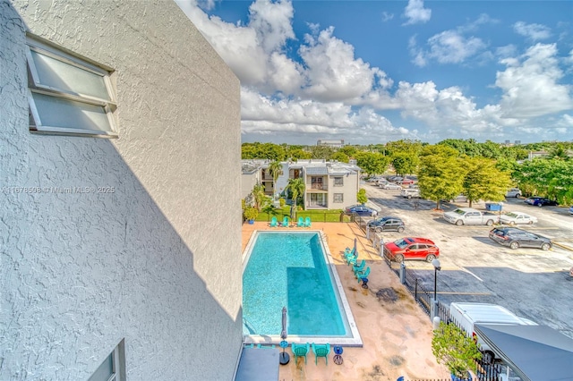 view of swimming pool featuring a patio area