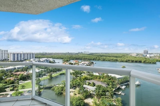 balcony featuring a water view