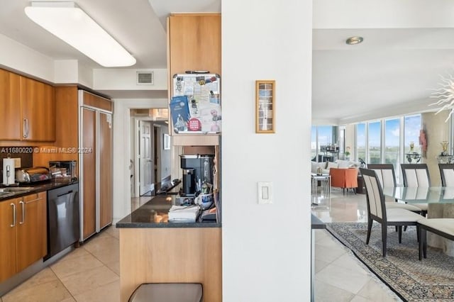 kitchen with light tile patterned flooring and dishwasher