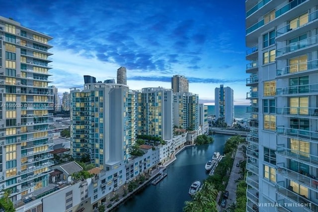 property's view of city featuring a water view