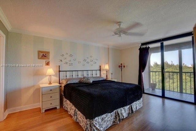 bedroom featuring ornamental molding, access to exterior, floor to ceiling windows, a textured ceiling, and light hardwood / wood-style flooring