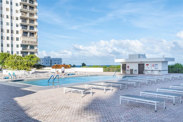 view of swimming pool with a patio