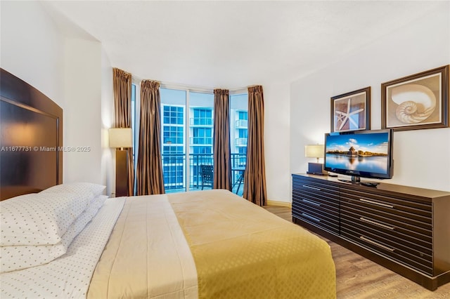 bedroom featuring wood finished floors