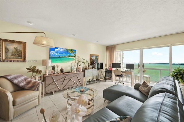 2451 Brickell Ave Unit 17G, Miami, FL 33129 - living room featuring light tile patterned floors and a desk