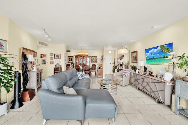 2451 Brickell Ave Unit 17G, Miami, FL 33129 - living room featuring light tile patterned floors and a chandelier