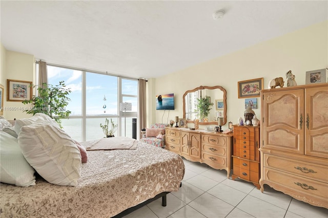 bedroom with light tile patterned floors