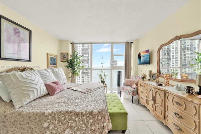 tiled bedroom featuring expansive windows