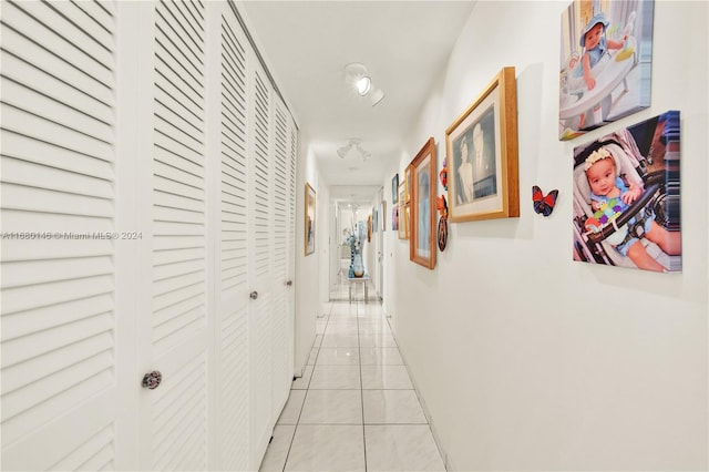 hallway with light tile patterned flooring