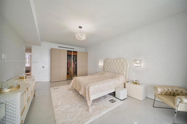 bedroom featuring an inviting chandelier