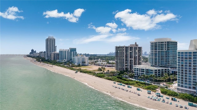 aerial view featuring a water view and a view of the beach