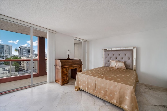 6767 Collins Ave Unit 602, Miami Beach, FL 33141 - bedroom featuring a city view, access to exterior, a textured ceiling, and a wall of windows