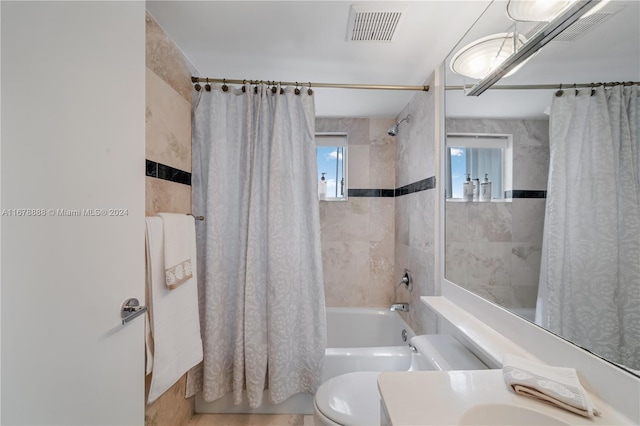 6767 Collins Ave Unit 602, Miami Beach, FL 33141 - full bathroom featuring shower / bath combo with shower curtain, toilet, and vanity