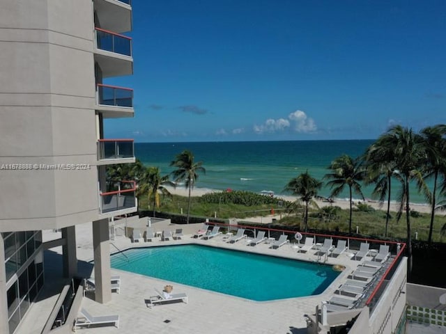 6767 Collins Ave Unit 602, Miami Beach, FL 33141 - community pool with a water view and a patio
