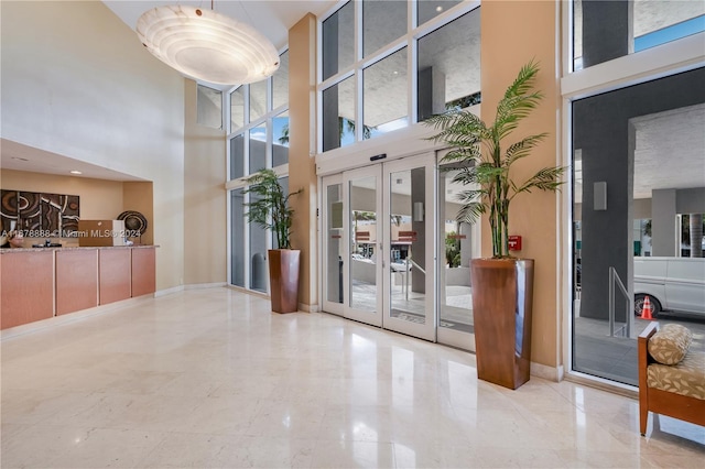 6767 Collins Ave Unit 602, Miami Beach, FL 33141 - common area featuring a towering ceiling
