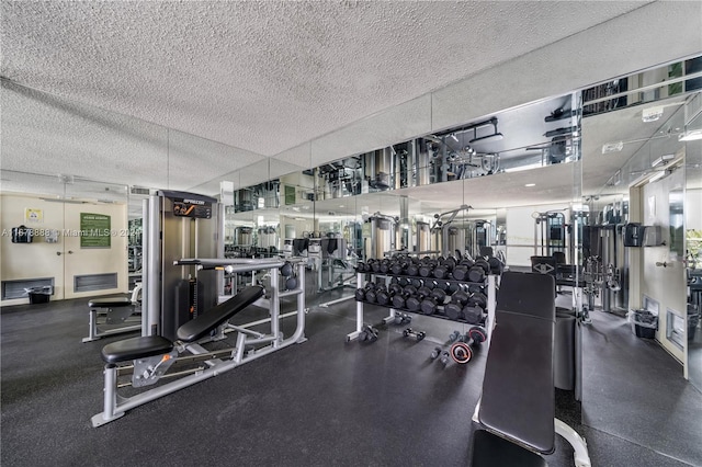 workout area featuring a textured ceiling and plenty of natural light