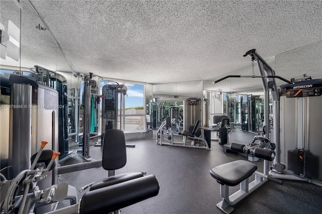 exercise room featuring a textured ceiling