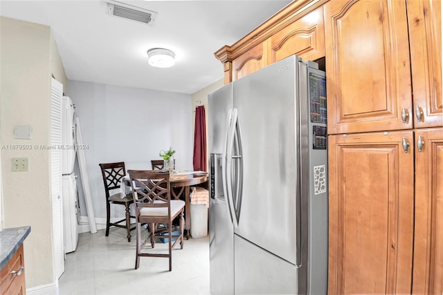 kitchen with stainless steel fridge with ice dispenser