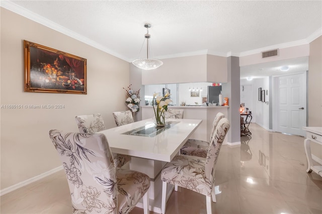 dining room with a textured ceiling and ornamental molding