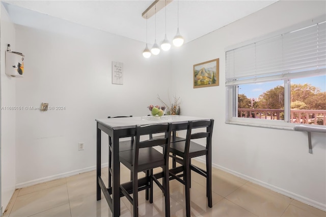 dining area with light tile patterned flooring