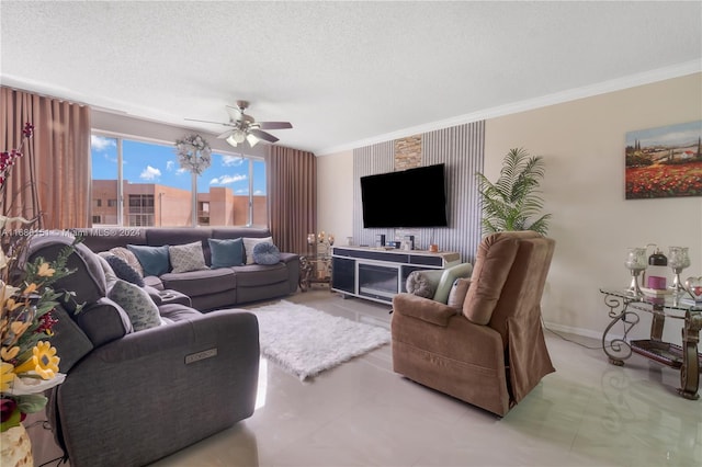 living room featuring ceiling fan, crown molding, and a textured ceiling