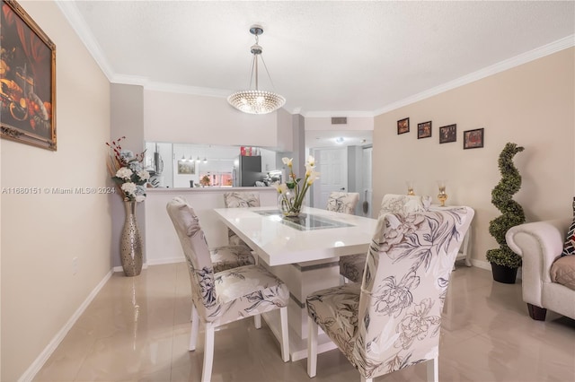 dining area with crown molding and a chandelier