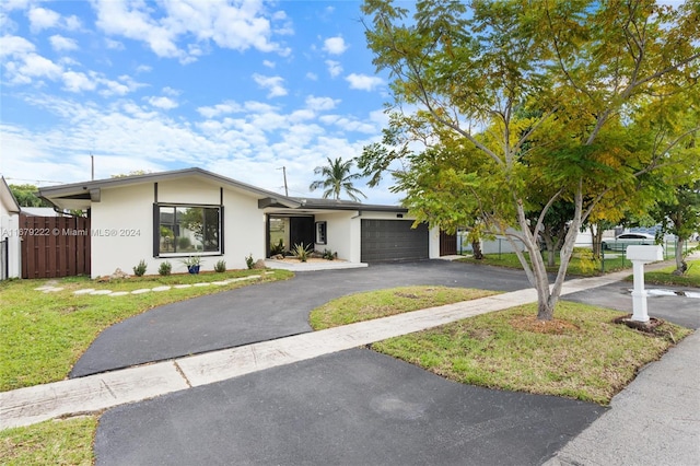 ranch-style home featuring a garage